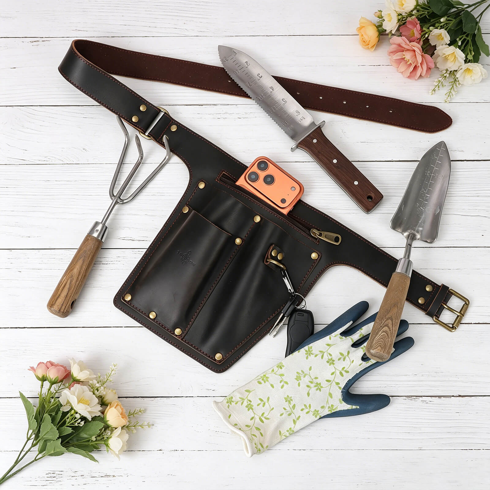 Durable full grain leather garden tool pouch with pruning shears in an outdoor garden Durable full grain leather garden tool pouch with pruning shears in an outdoor garden